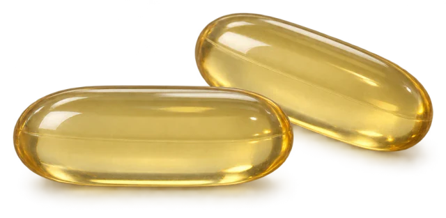 Illustration: two closed golden algae-oil softgels